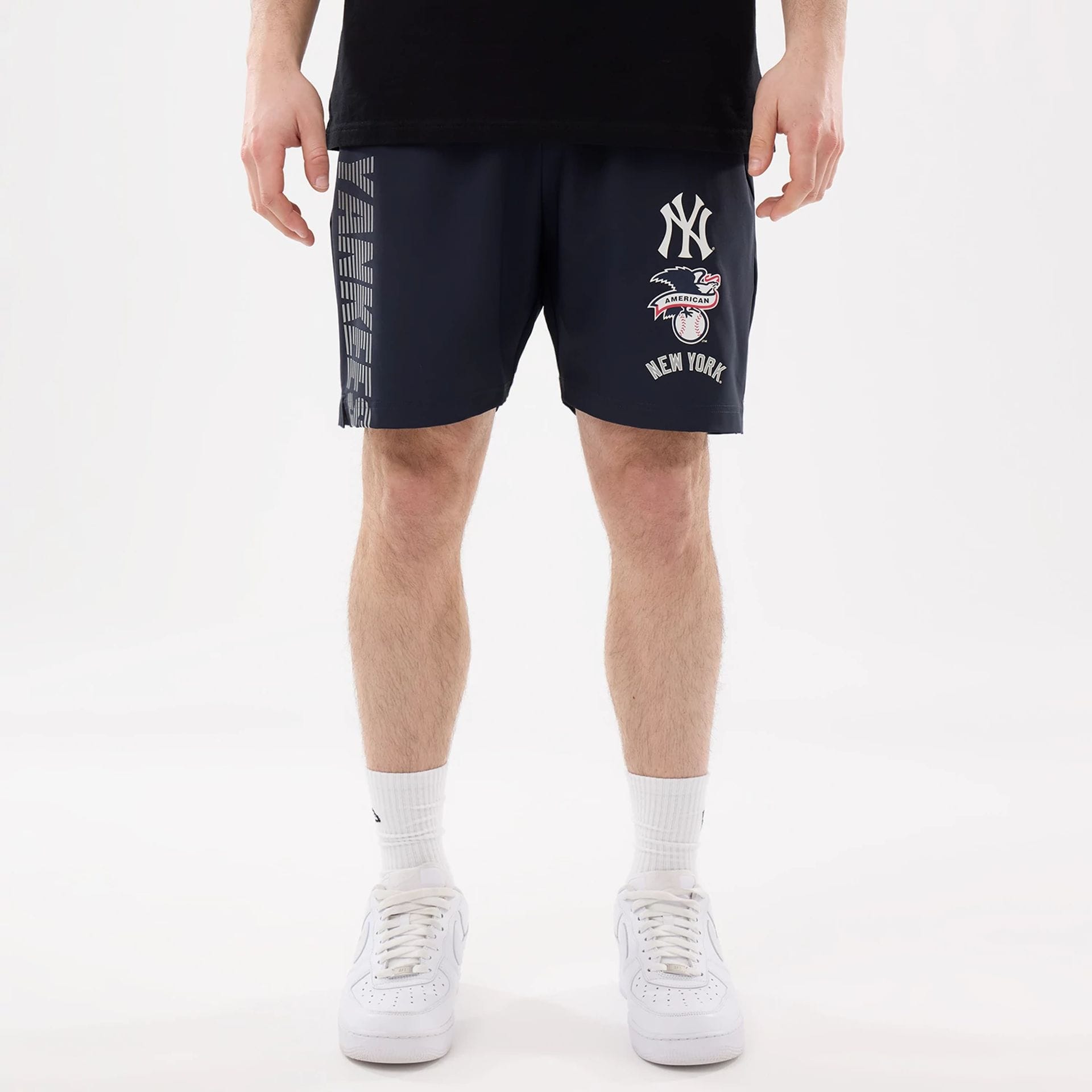The model is wearing this MLB Match New York Yankees Oversized Shorts in navy. 1