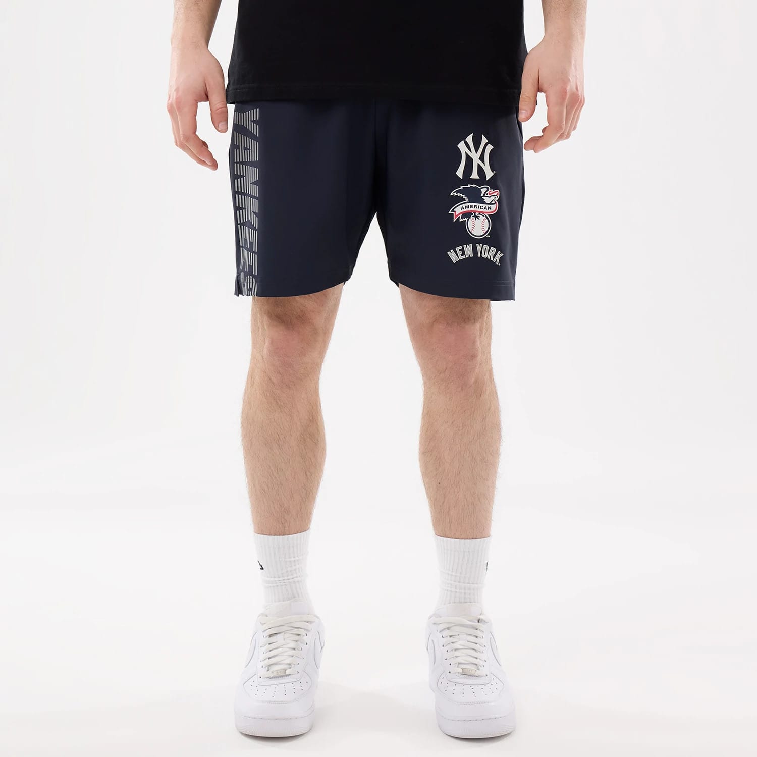 The model is wearing this MLB Match New York Yankees Oversized Shorts in navy. 1