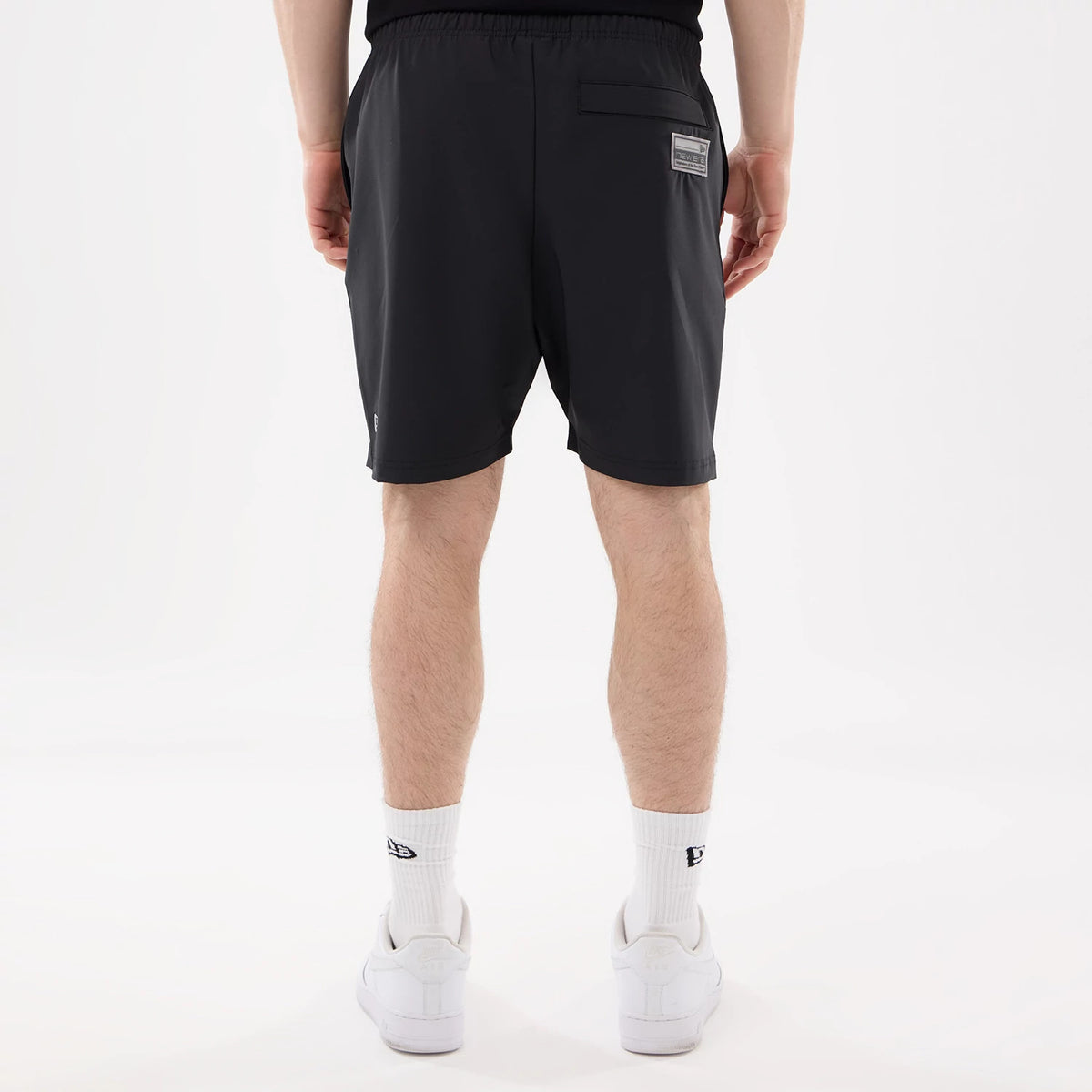 The model is wearing this NFL Match Las Vegas Raiders Oversized Shorts in black. 2