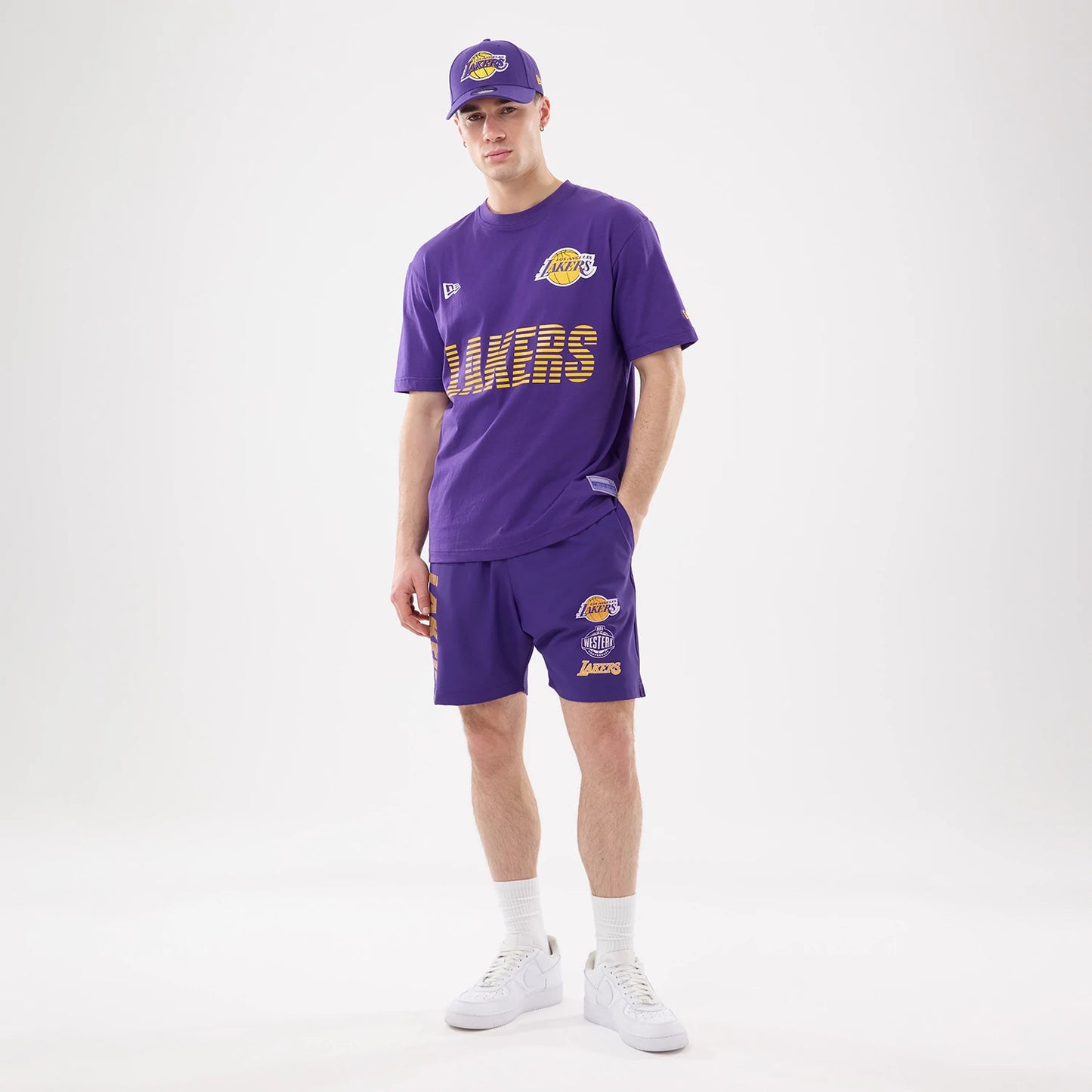 The model is wearing this NBA Match LA Lakers Oversized Shorts in purple. 6