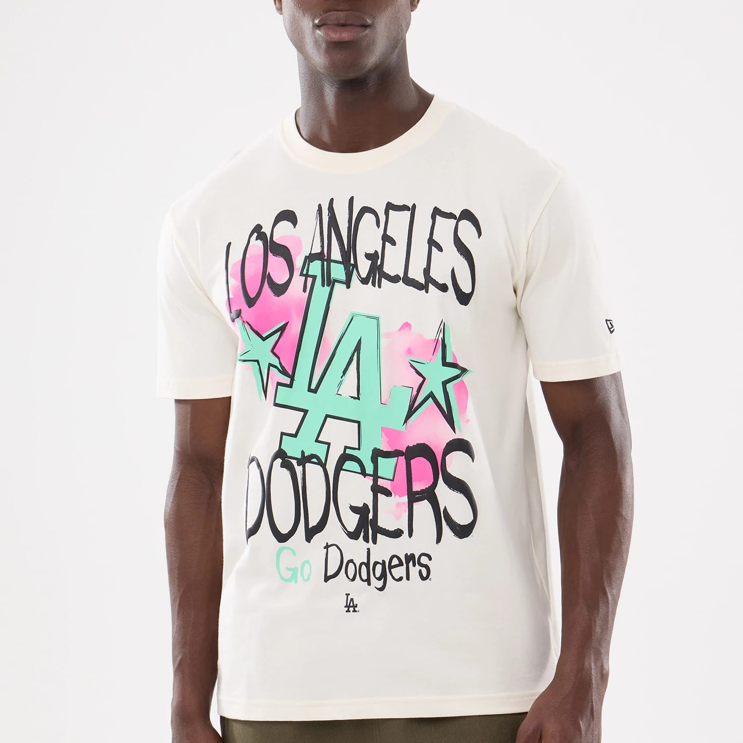 The model is wearing this MLB Street Art Graphic LA Dodgers T-Shirt in light beige. 4