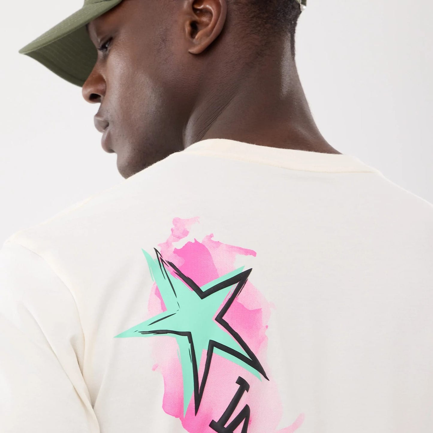 The model is wearing this MLB Street Art Graphic LA Dodgers T-Shirt in light beige. 6