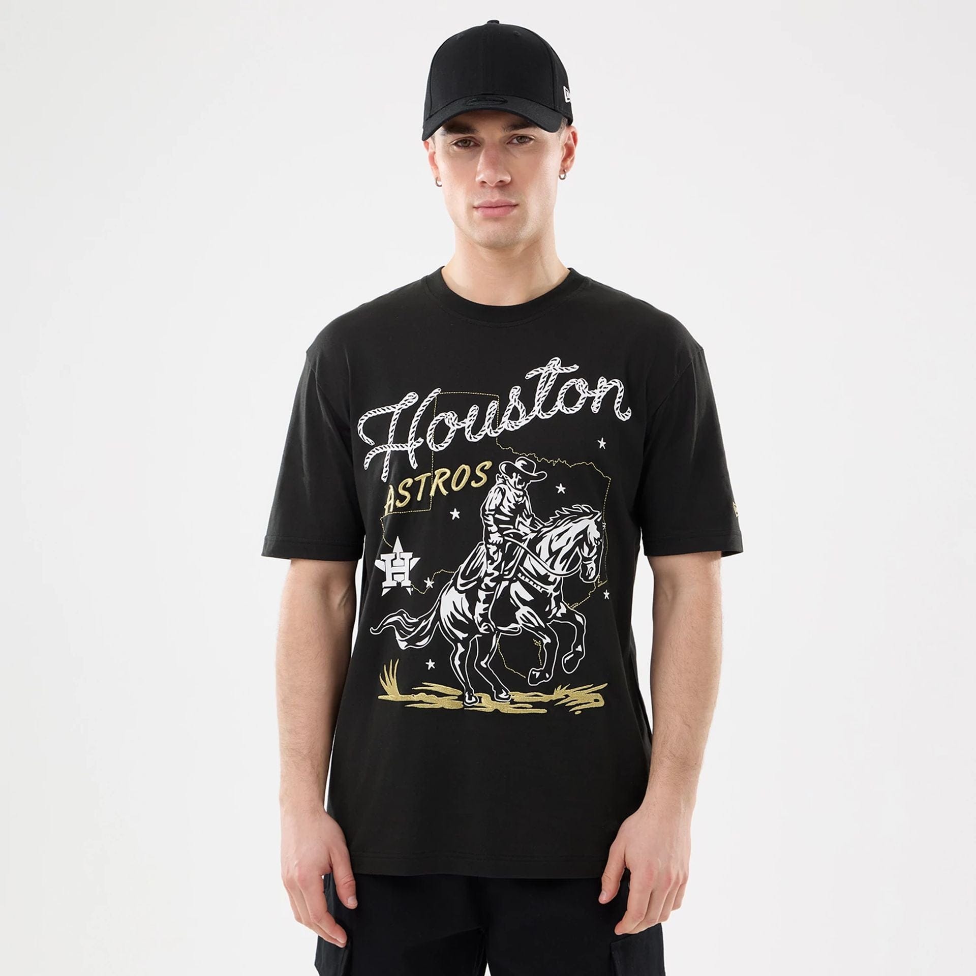 The model is wearing this MLB Cowboy Graphic Houston Astros T-Shirt in black. 1