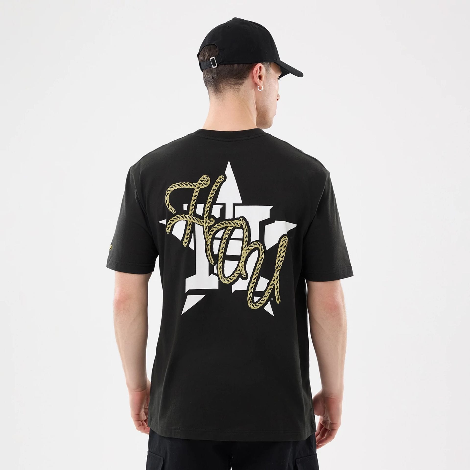 The model is wearing this MLB Cowboy Graphic Houston Astros T-Shirt in black. 2