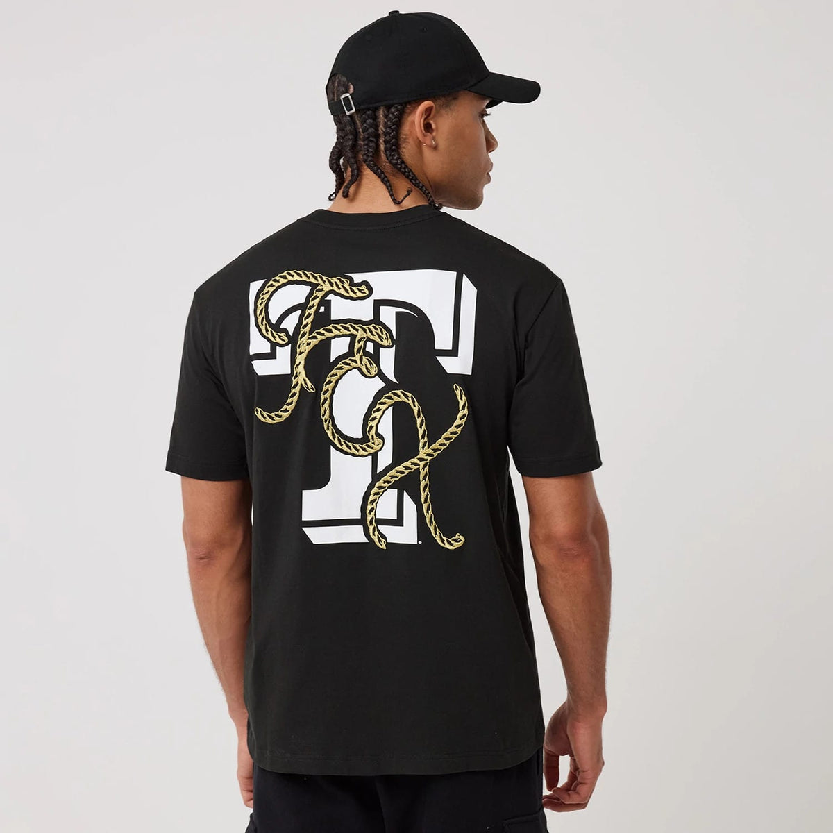 The model is wearing this MLB Cowboy Graphic Texas Rangers T-Shirt in black. 2