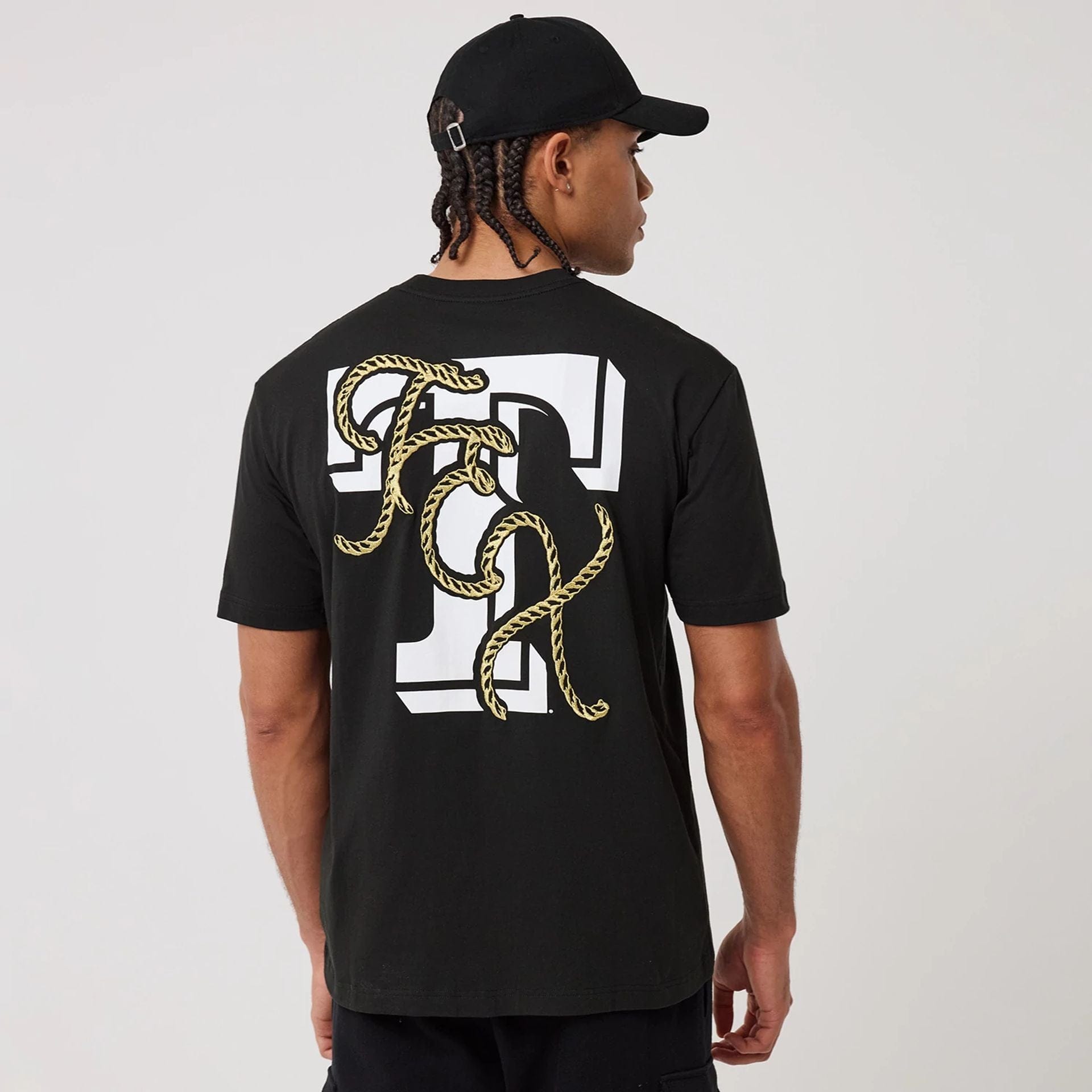 The model is wearing this MLB Cowboy Graphic Texas Rangers T-Shirt in black. 2