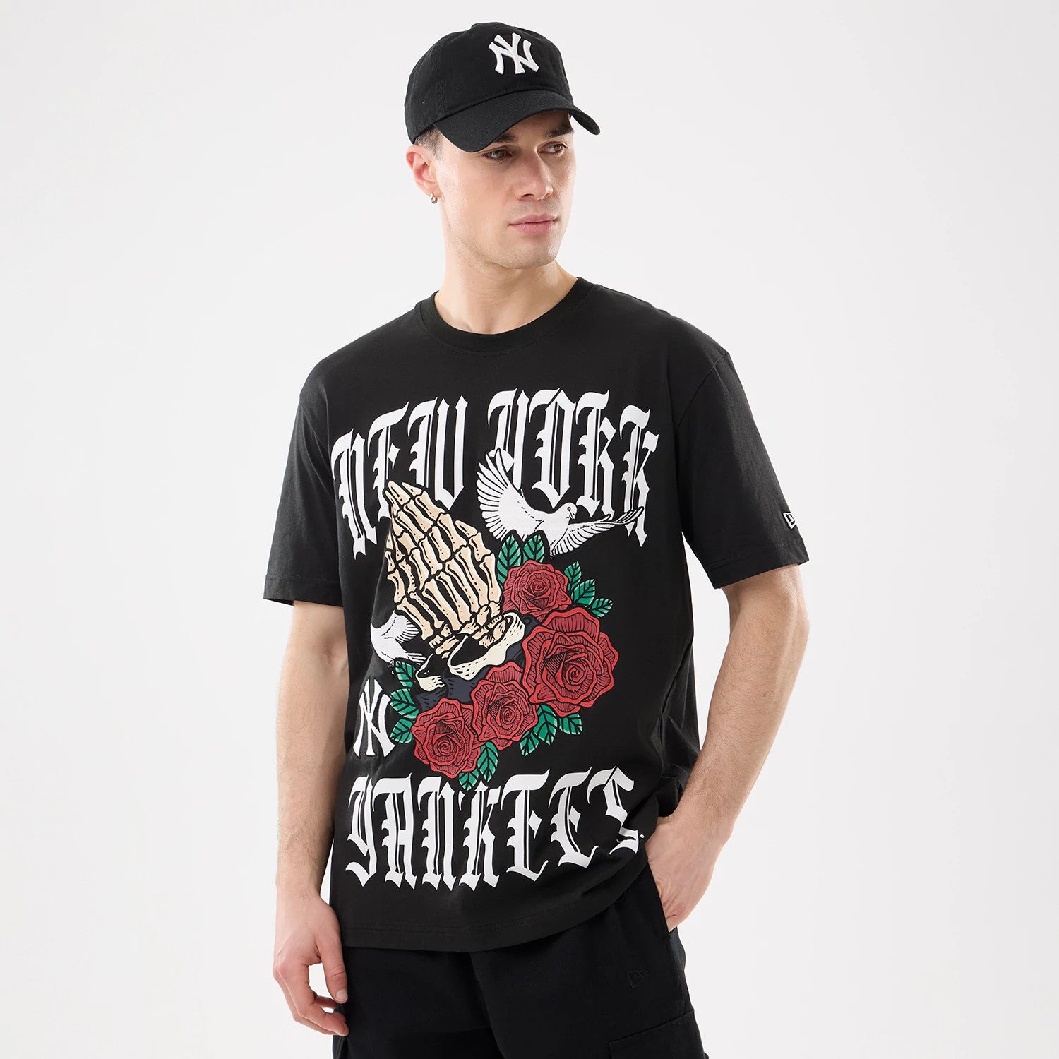 The model is wearing this MLB Script Graphic New York Yankees T-Shirt in black. 1