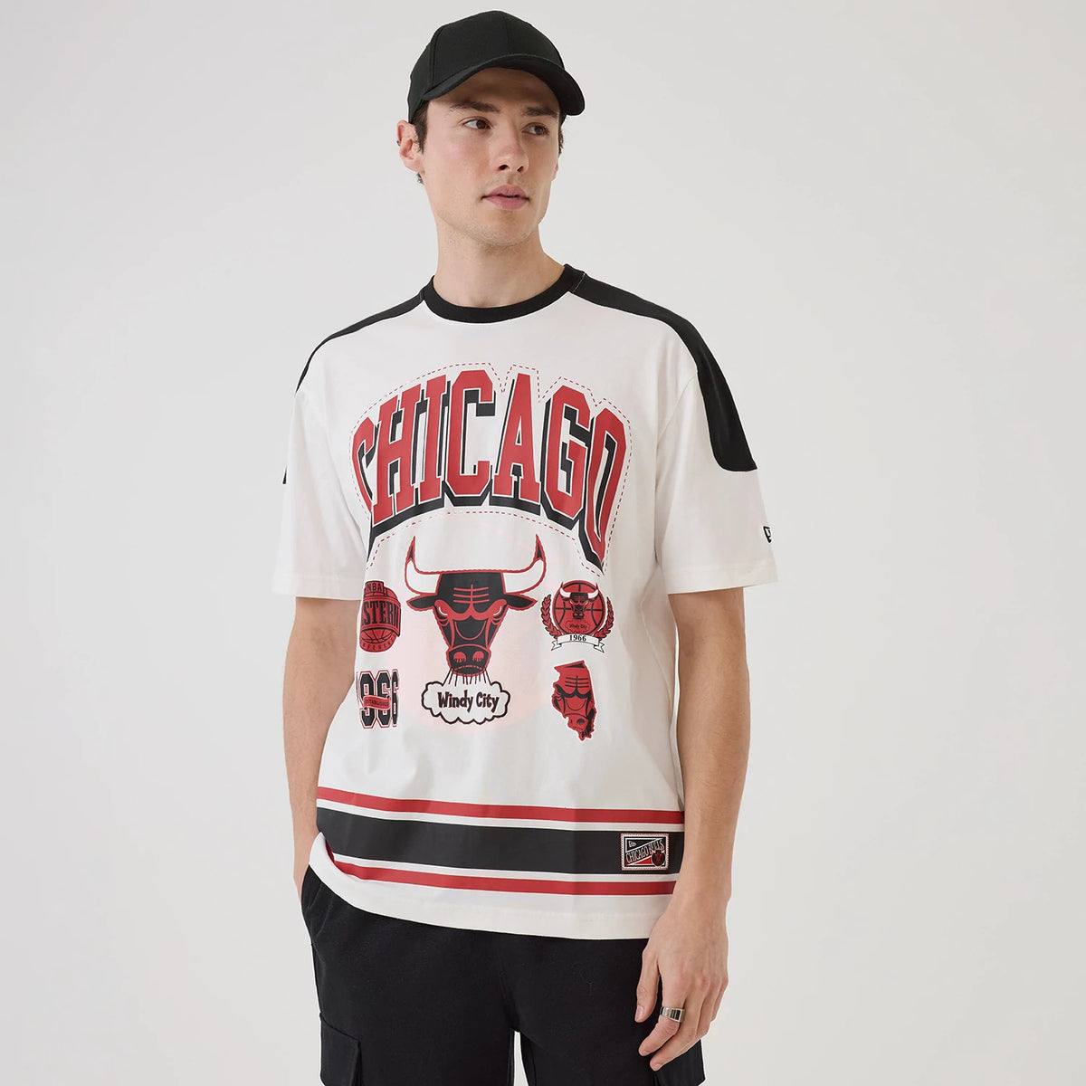 New Era Chicago Bulls NBA Sport Classic White T-Shirt, front view on-model displaying Chicago Bulls graphics in red and black, with the New Era logo embroidered on the left sleeve and black accents on the shoulders.