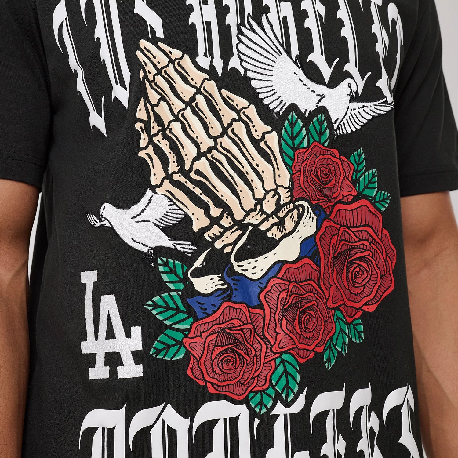 The model is wearing this MLB Script Graphic LA Dodgers T-Shirt in black. 4