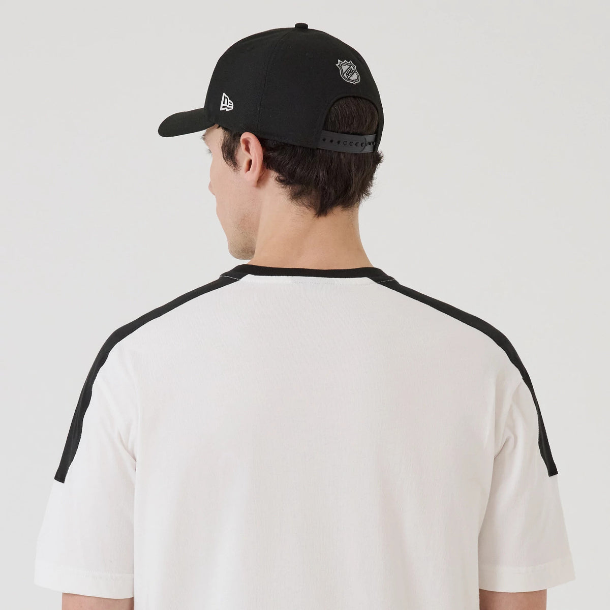 The model is wearing this NHL Sport Classic LA Kings T-Shirt in white. 7