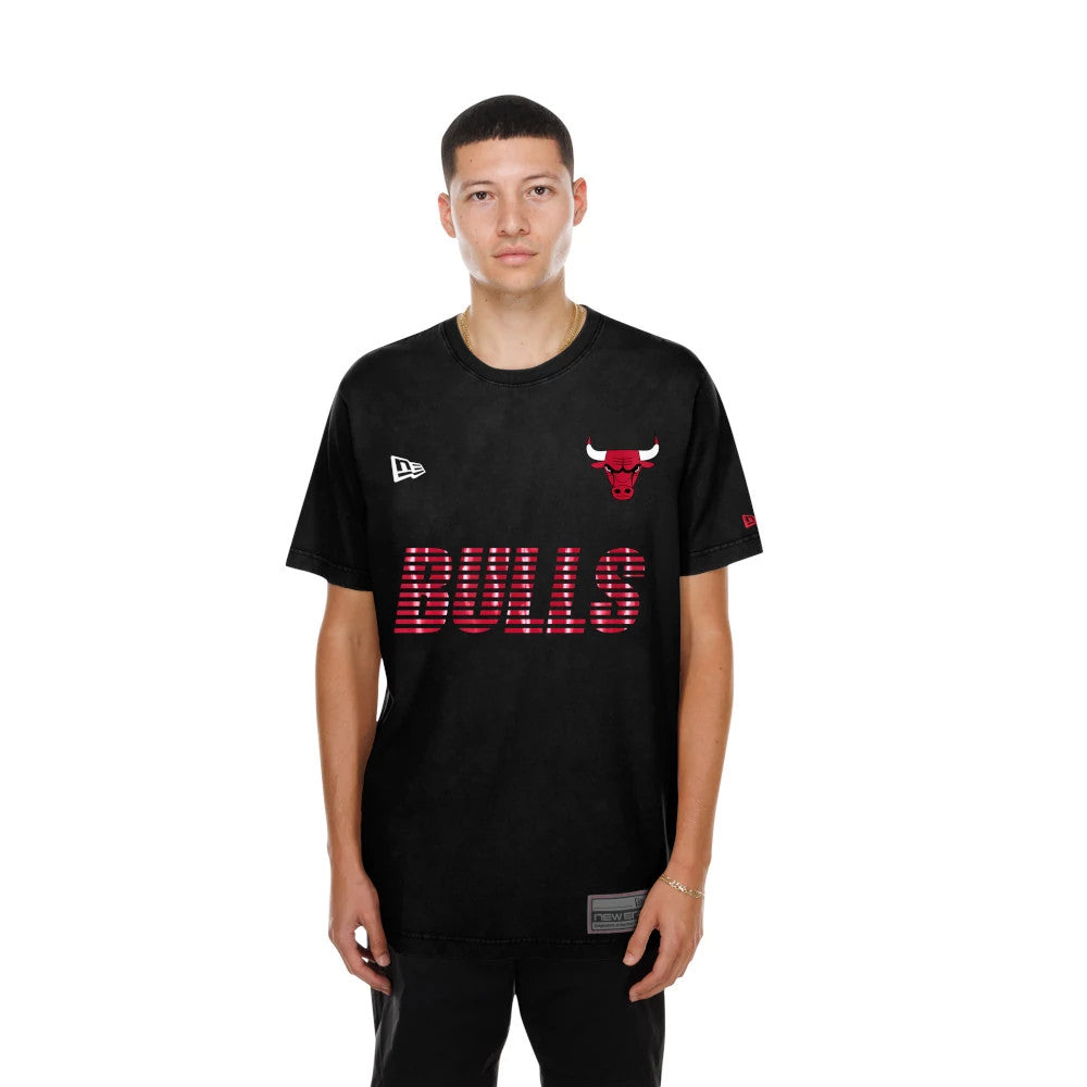 New Era Chicago Bulls NBA Match Black T-Shirt, front view on-model displaying the red Bulls lettering and embroidered bull logo on the chest, a white embroidered New Era logo on the left shoulder and a patch near the lower hem.