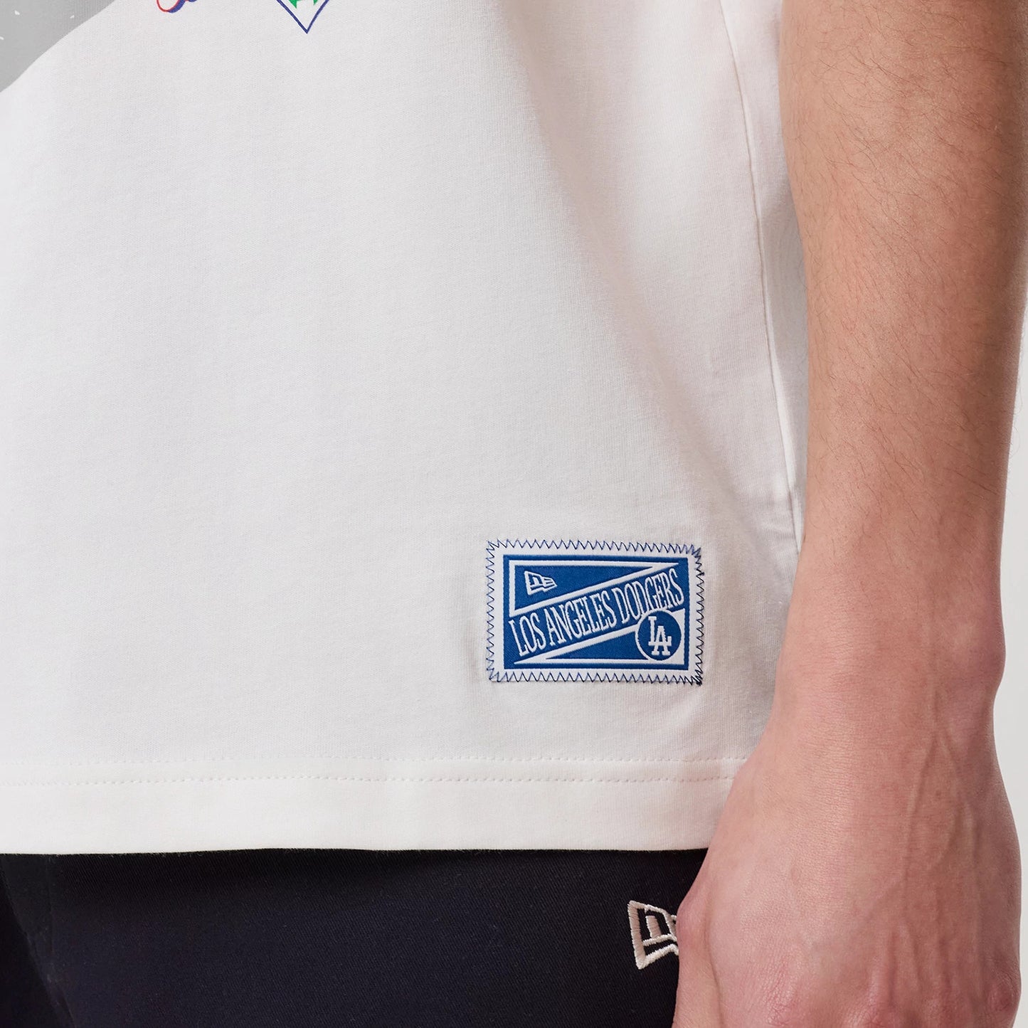The model is wearing this MLB Sport Classic LA Dodgers T-Shirt in white. 7