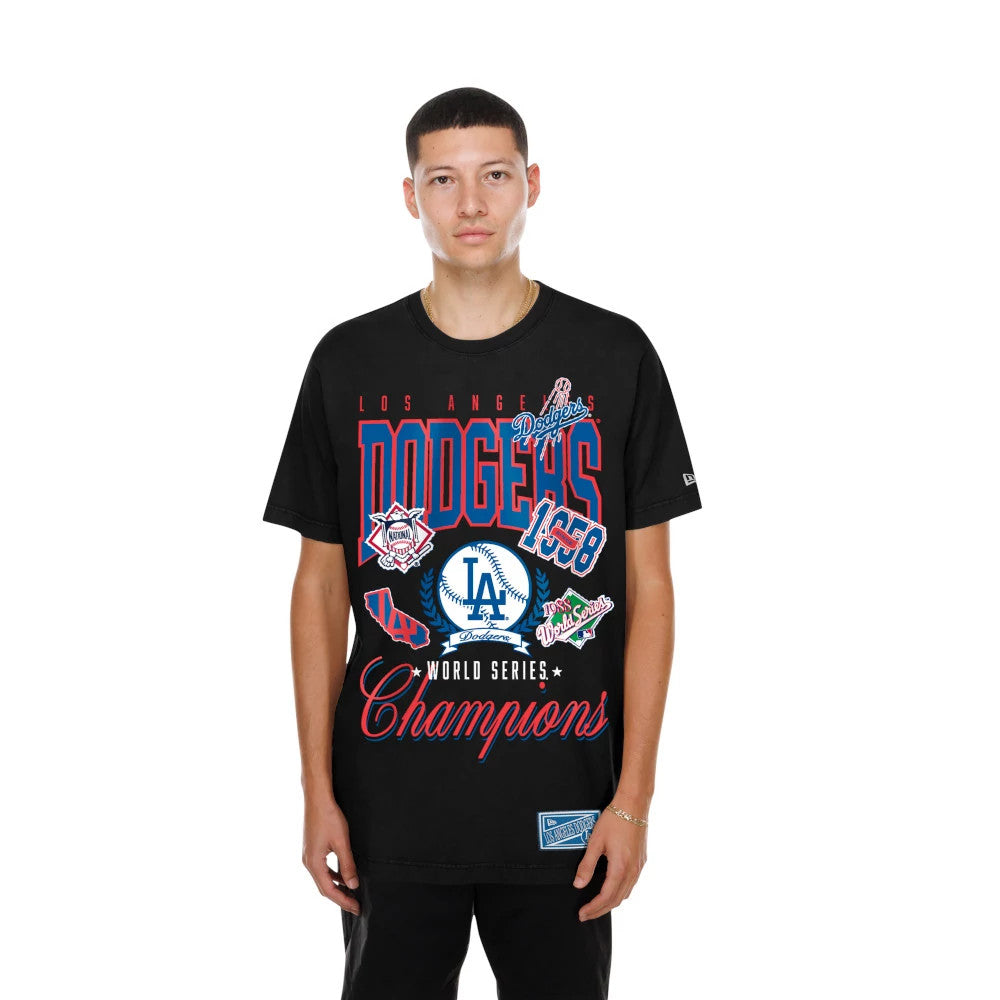 New Era LA Dodgers MLB Sport Classic Black T-Shirt, front view on-model displaying red Dodgers lettering, multiple baseball-themed graphics, an embroidered New Era logo on the sleeve, and a Champions script across the lower front.