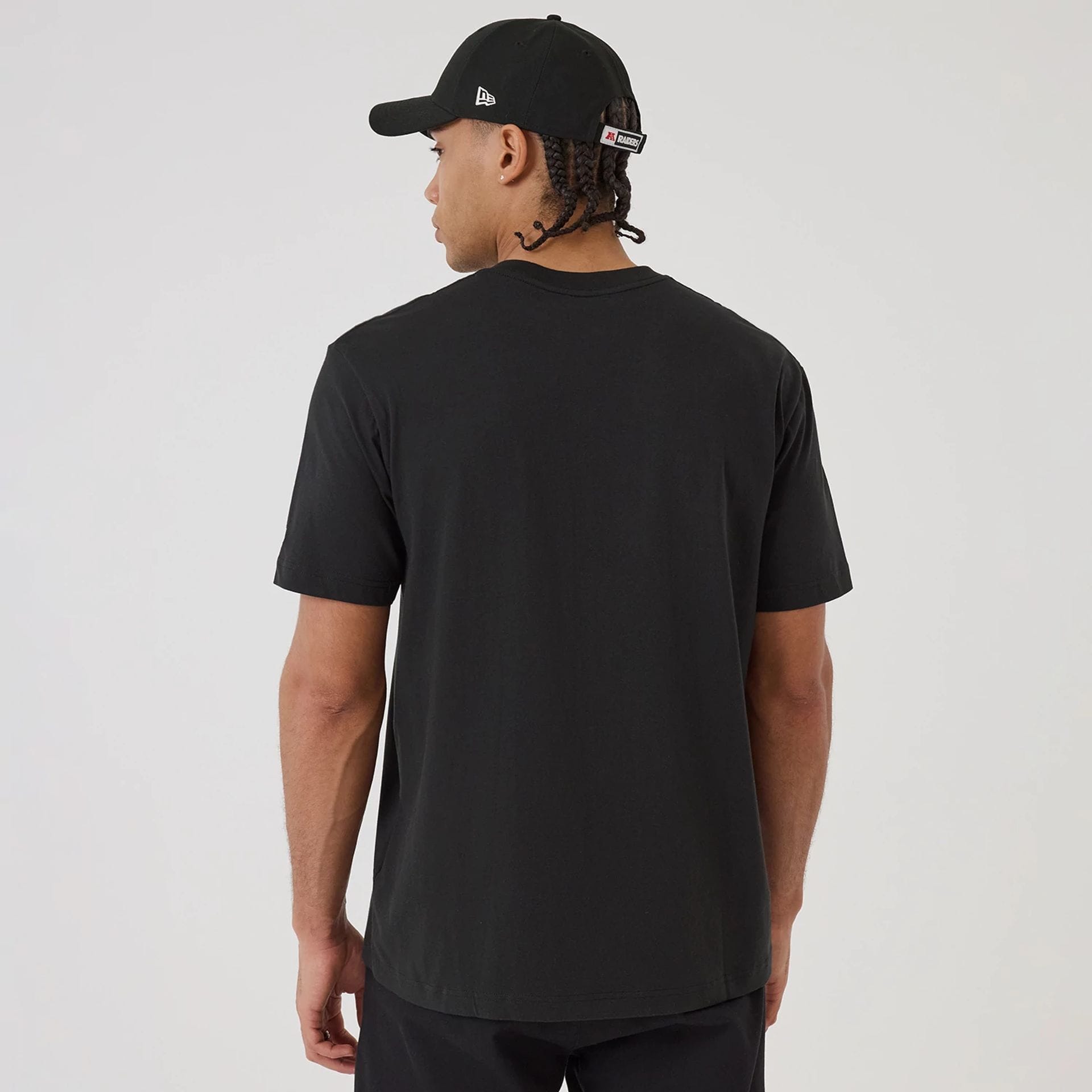 The model is wearing this NFL Sport Classic Las Vegas Raiders T-Shirt in black. 2