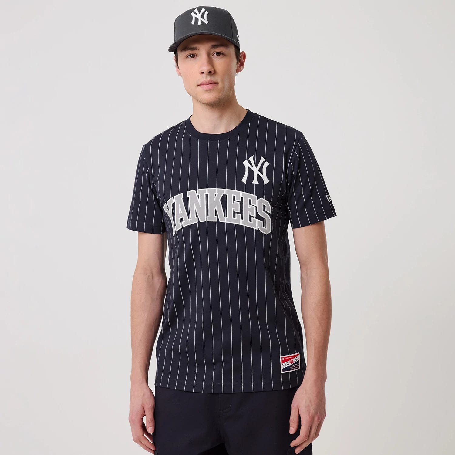 The model is wearing this MLB Pinstripe New York Yankees T-Shirt in navy. 1