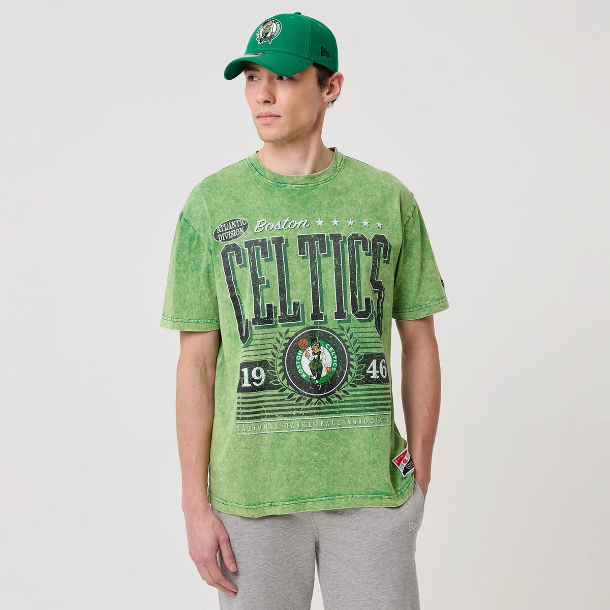 The model is wearing this NBA Boston Celtics T-Shirt in green. 1