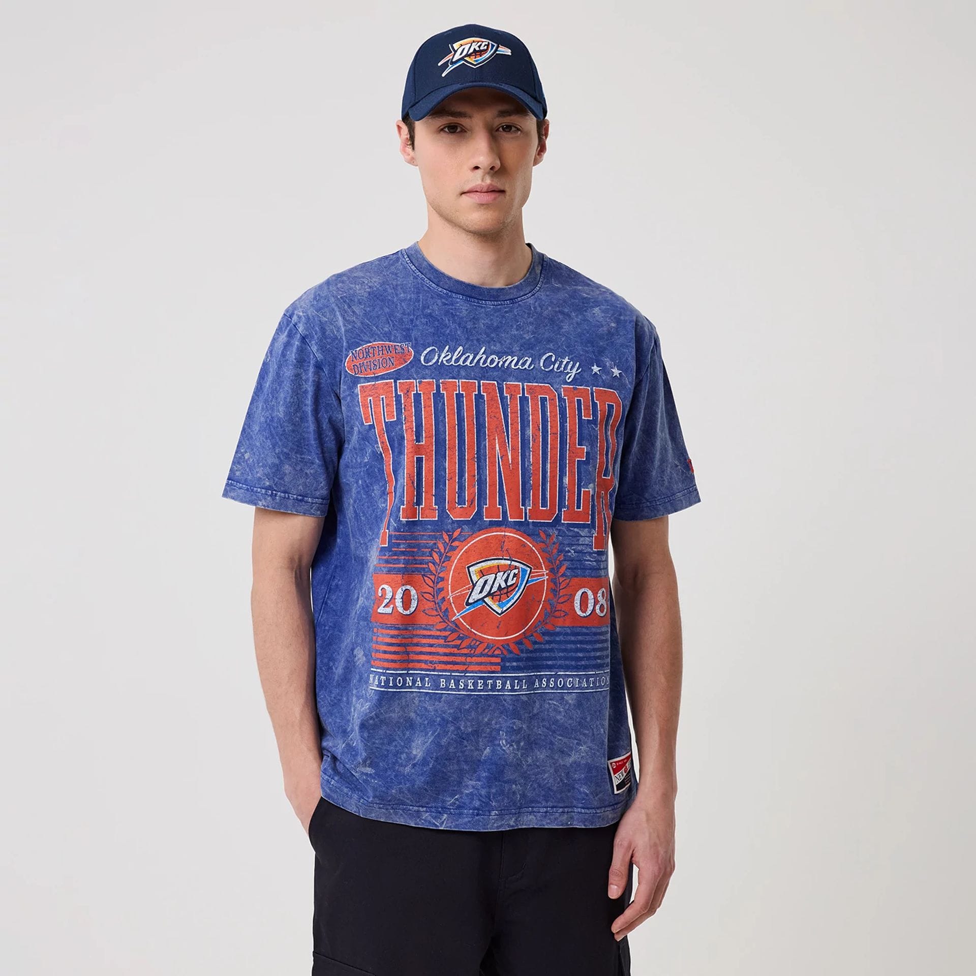 The model is wearing this NBA Oklahoma City Thunder T-Shirt in blue. 1