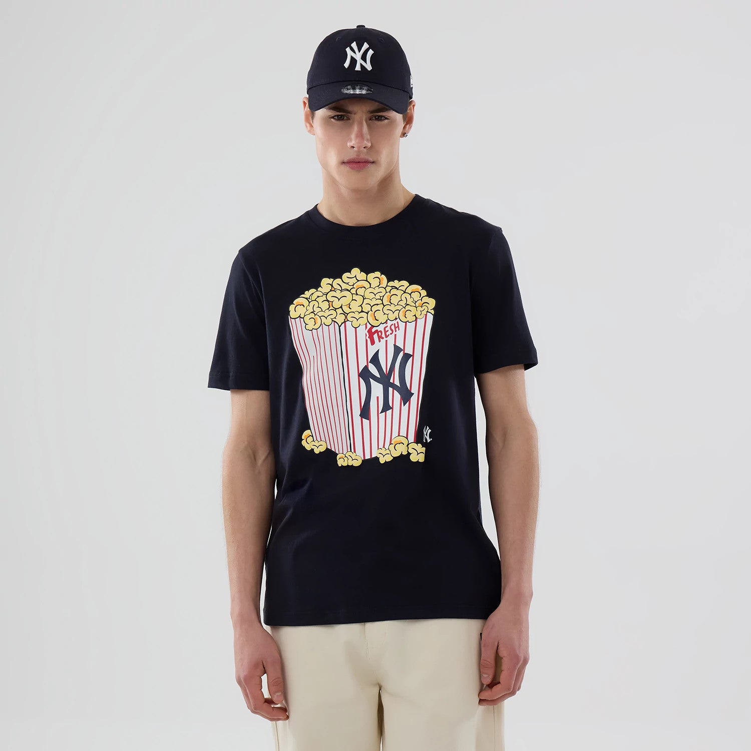The model is wearing this MLB Popcorn New York Yankees T-Shirt in navy. 1