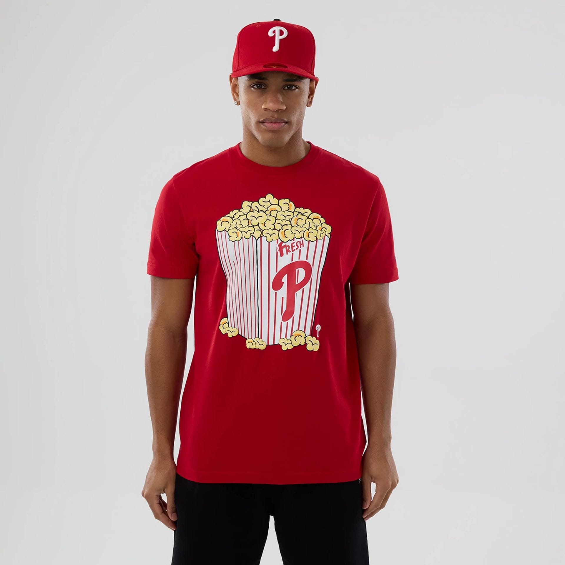 The model is wearing this MLB Popcorn Philadelphia Phillies T-Shirt in red. 1