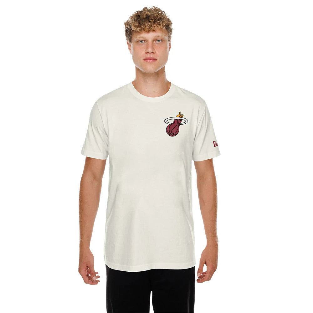 New Era Miami Heat NBA Hotdog Cream T-Shirt, front view on-model displaying the Miami Heat logo embroidered on the left chest and a small New Era logo on the left sleeve, styled with black trousers.