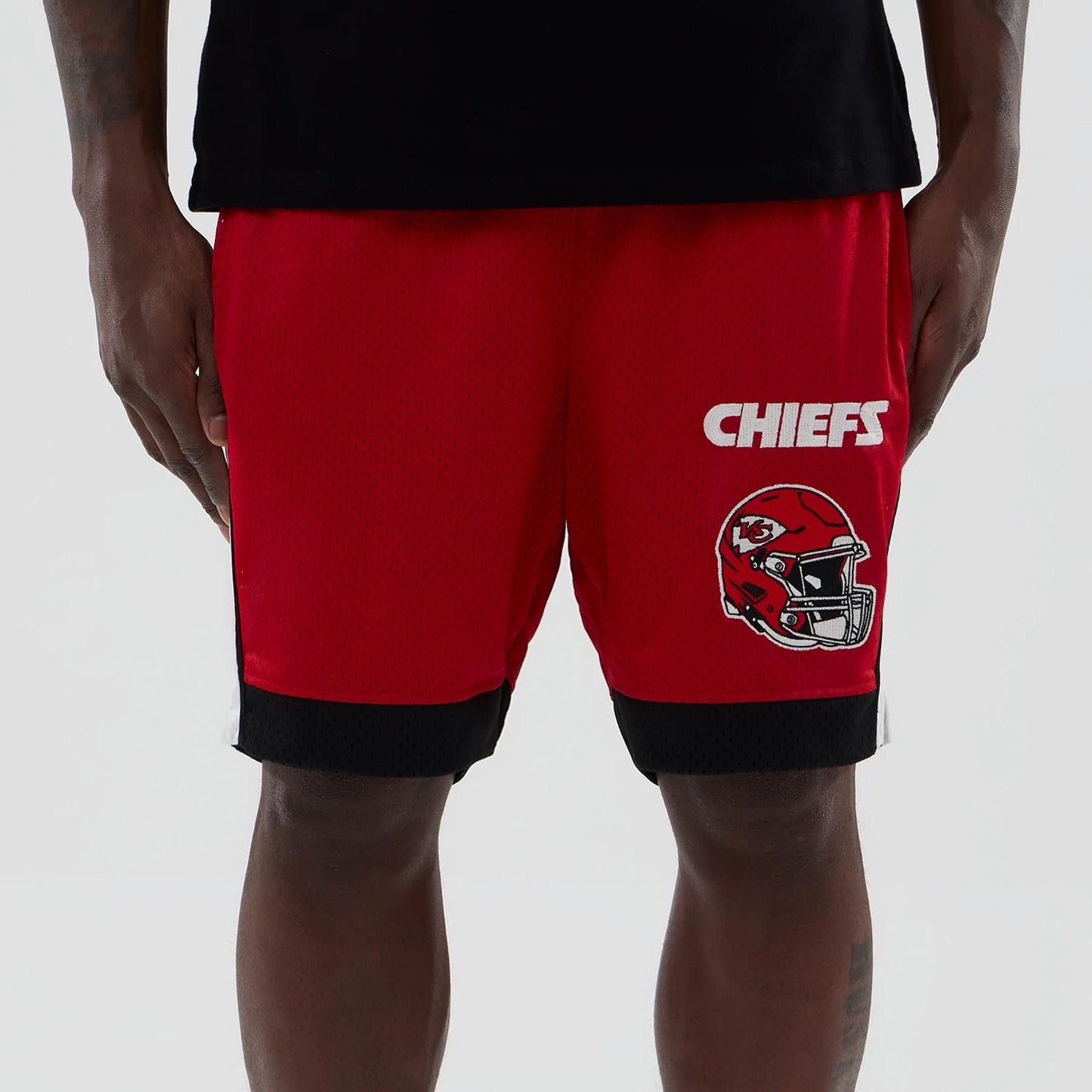 The model is wearing these NFL Kansas City Chiefs Mesh Shorts in red. 5
