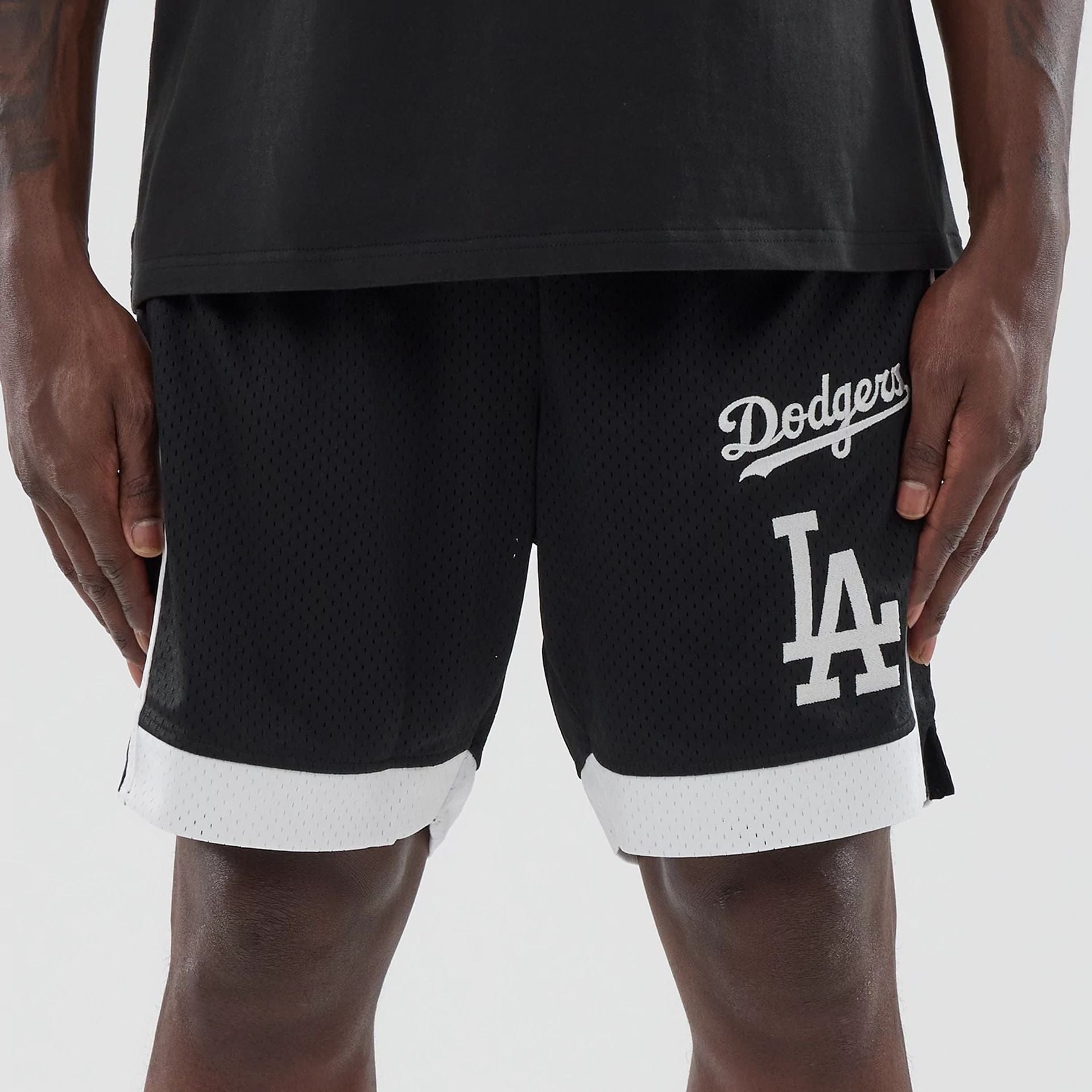 The model is wearing these MLB LA Dodgers Mesh Shorts in black. 2