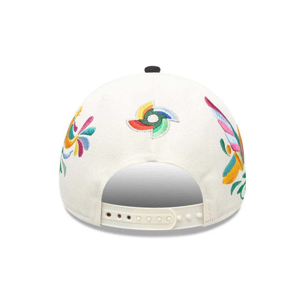 Mexico WBC Latin Embroidery White New Era 9FORTY M-Crown A-Frame Adjustable Cap, rear view showing colourful embroidered floral designs and a multicoloured emblem on the back panels, with a white adjustable snap closure at the base.