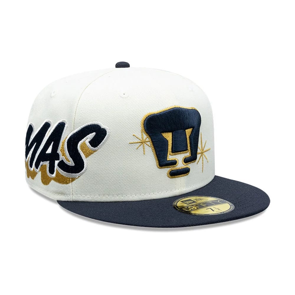 Pumas Unam Liga MX White New Era 59FIFTY Fitted Cap, front view showing a raised embroidered navy and gold Pumas logo on the white front panel with a flat black visor and a gold 59FIFTY size sticker.
