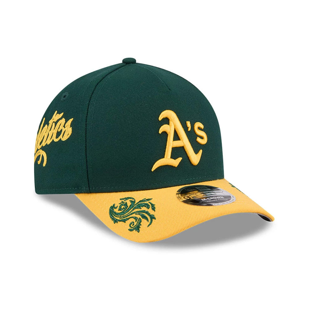 Athletics MLB Script Dark Green New Era 9FORTY M-Crown A-Frame Adjustable Cap, three-quarter view showing a raised gold embroidered A's logo on the dark green crown, with a decorative green pattern on the yellow visor and a 9FORTY size sticker.