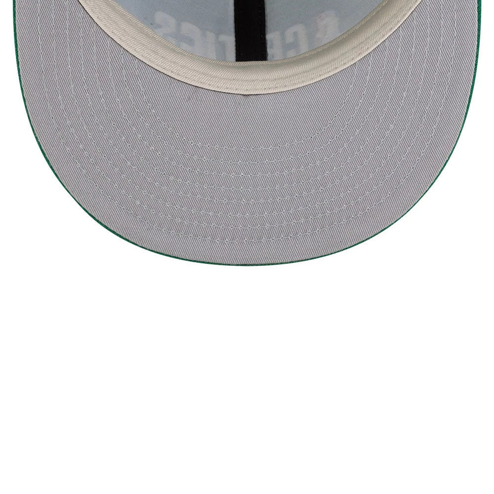 Boston Celtics FOG x NBA Green Retro Crown New Era 9FIFTY Adjustable Cap, inside view showing the grey undervisor with green edge, and a black sweatband with cap label printing on the inner crown.