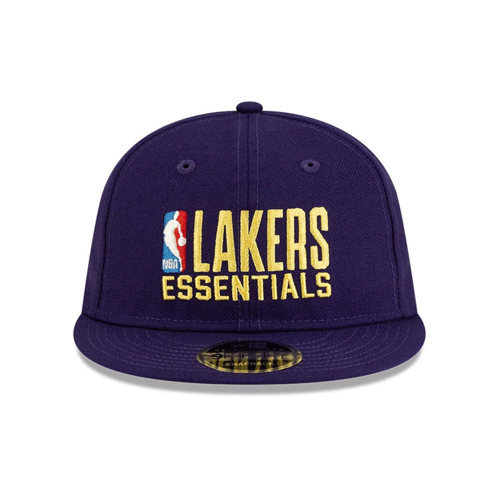 LA Lakers FOG x NBA Dark Purple Retro Crown New Era 9FIFTY Adjustable Cap, front view showing the raised gold Lakers Essentials logo with the NBA logo on the front panel and a 9FIFTY size sticker on the dark purple visor.