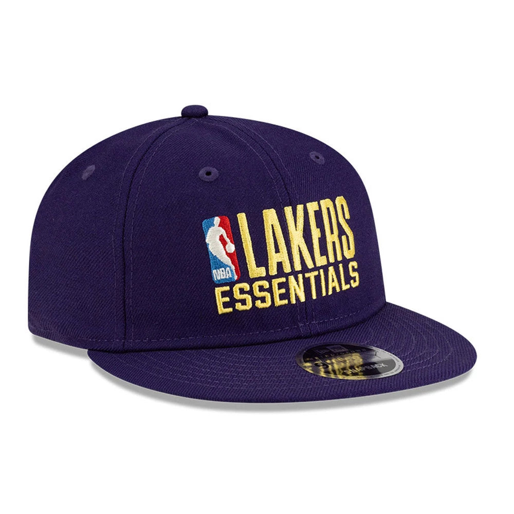 LA Lakers FOG x NBA Dark Purple Retro Crown New Era 9FIFTY Adjustable Cap, three-quarter view showing the raised NBA Lakers Essentials logo in yellow and an NBA logo, with a black 9FIFTY size sticker on the flat dark purple visor.