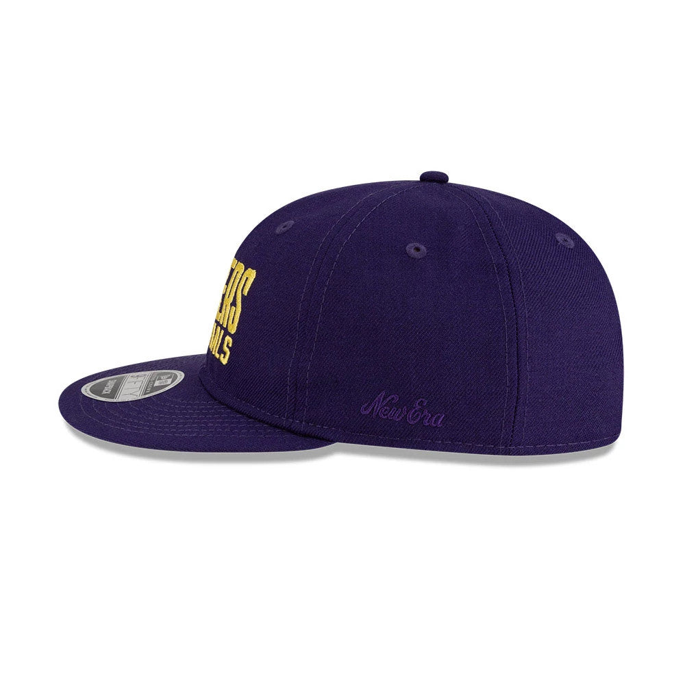 LA Lakers FOG x NBA Dark Purple Retro Crown New Era 9FIFTY Adjustable Cap, side view showing the embroidered New Era script on the dark purple side panel, with a curved visor and 9FIFTY size sticker on the visor.