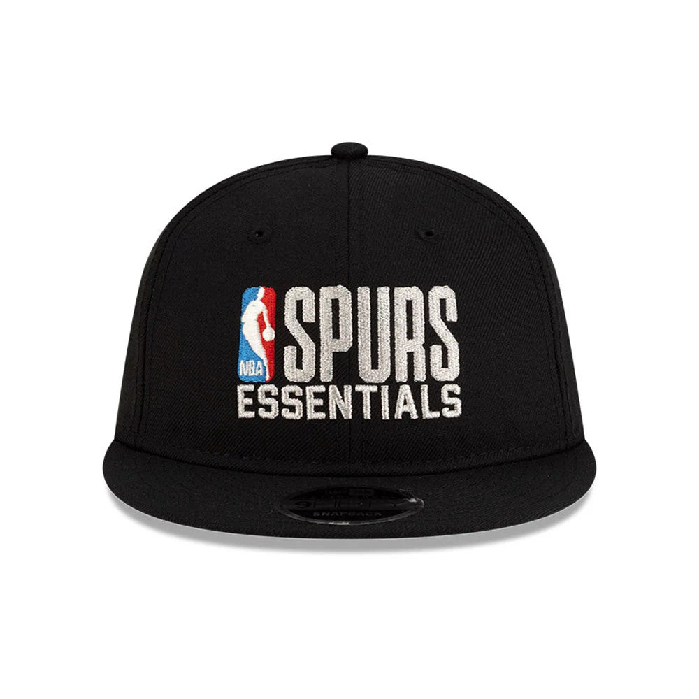 San Antonio Spurs FOG x NBA Black Retro Crown New Era 9FIFTY Adjustable Cap, front view showing raised white SPURS ESSENTIALS embroidery and NBA logo on the black structured crown with a matching black visor and 9FIFTY size sticker.