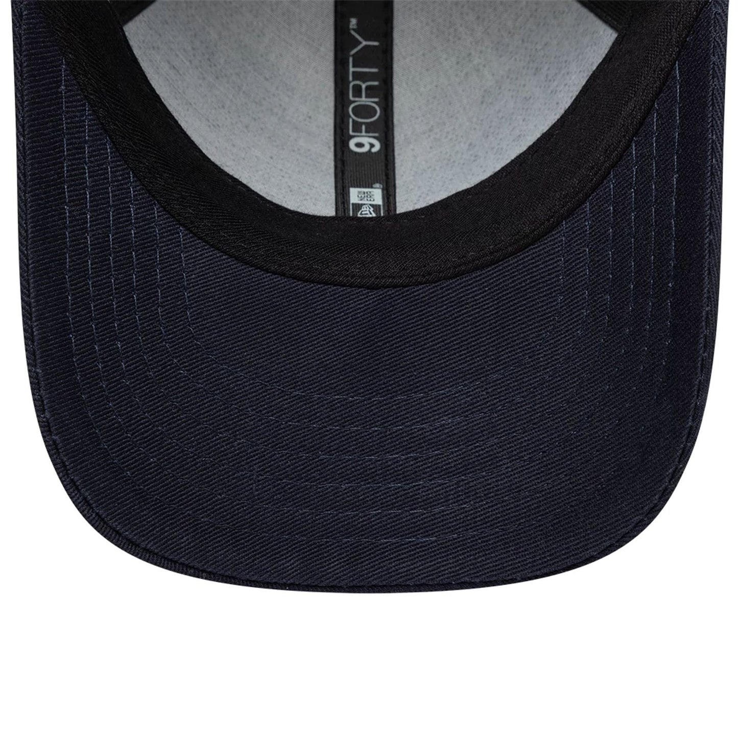 Red Bull Racing Infant My 1st Knit Dark Blue New Era 9FORTY Adjustable Cap, inside view showing a grey undervisor, a black sweatband, and a black interior taping with the 9FORTY logo along the seam.