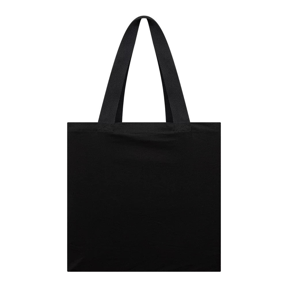 New Era Shield Logo NFL Dublin Game 2025 Black Tote Bag, front view showing a plain black tote bag with two handles, featuring a raised New Era logo located discreetly at the edge and no graphics or embellishments.
