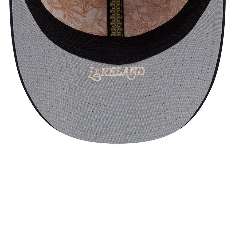 Detroit Tigers MLB Spring Training 2026 Red Low Profile New Era 59FIFTY Fitted Cap, inside view showing the beige floral patterned fabric, green and yellow taping, and grey undervisor with cream Lakeland lettering.