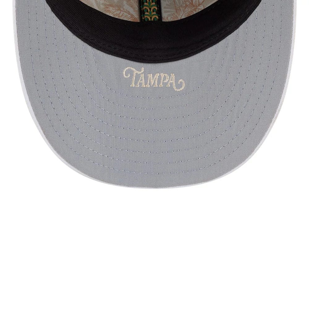 Yankees MLB Spring Training 2026 Navy Low Profile New Era 59FIFTY Fitted Cap, inside view showing grey undervisor with Tampa embroidered in cream, featuring a floral-patterned taping and black sweatband.