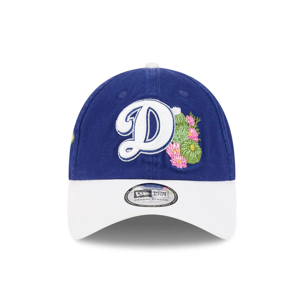 New Era LA Dodgers MLB Spring Training 2026 Dark Blue Casual Classic Adjustable Cap, front view showing a white embroidered D logo with colourful floral details on the dark blue crown, complemented by a white curved visor.