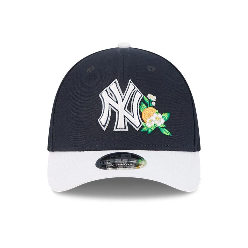 Yankees MLB Spring Training 2026 Navy New Era 39THIRTY M-Crown Stretch Fit Cap, front view showing the white raised NY logo with orange and green floral embroidery on the front panel, navy crown, white curved visor, and 39THIRTY size sticker.