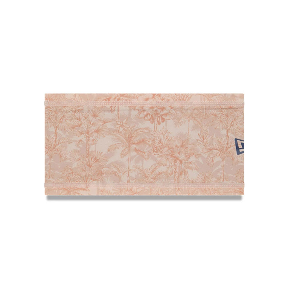 New Era Cactus League Logo MLB Spring Training 2026 All Over Print Headband, front view showing a tropical palm tree pattern in light pink tones with a blue New Era flag logo on the right side.