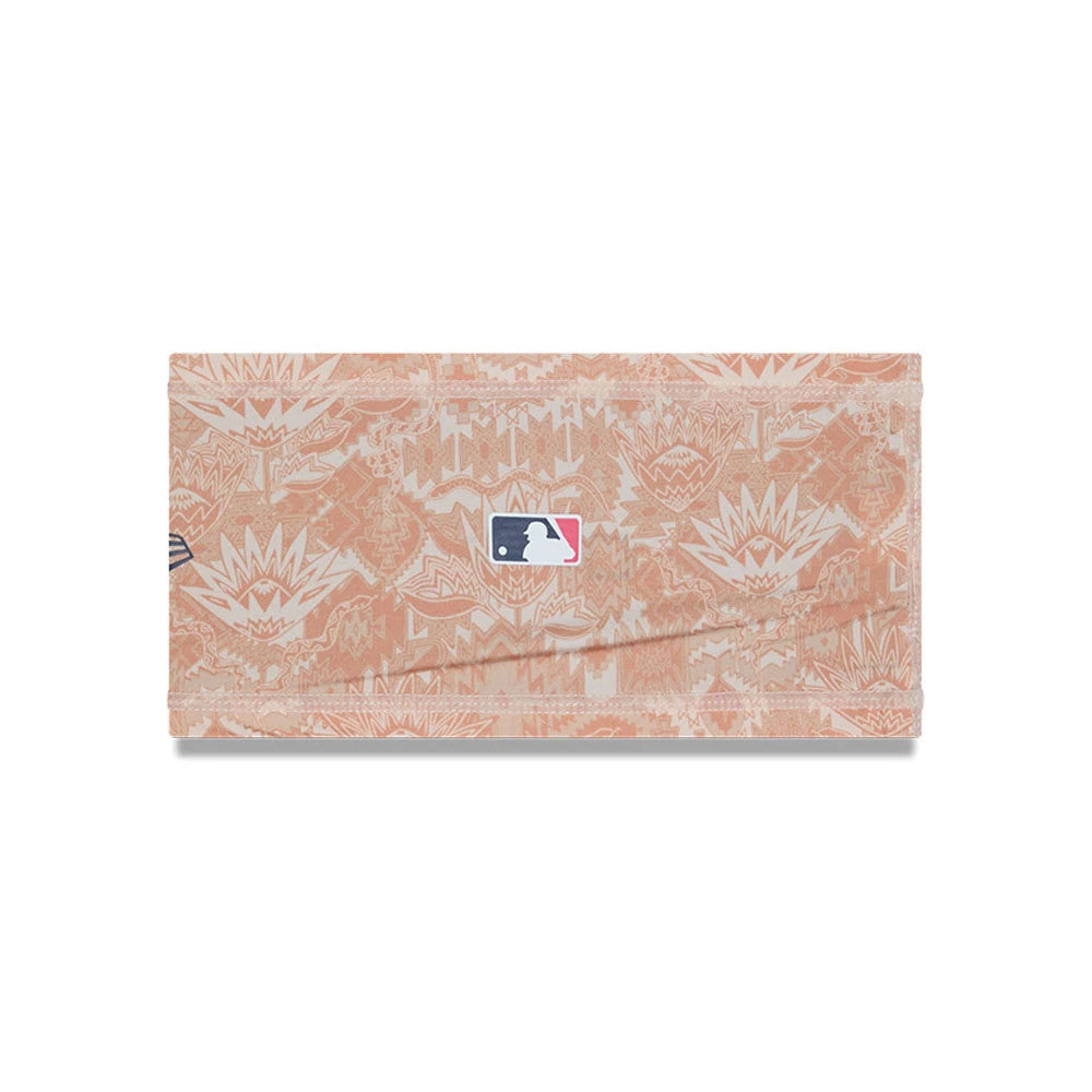 New Era Grapefruit League Logo MLB Spring Training 2026 All Over Print Headband, front view showing an MLB logo patch centred on a peach and beige geometric patterned fabric with the New Era flag logo on the left side.