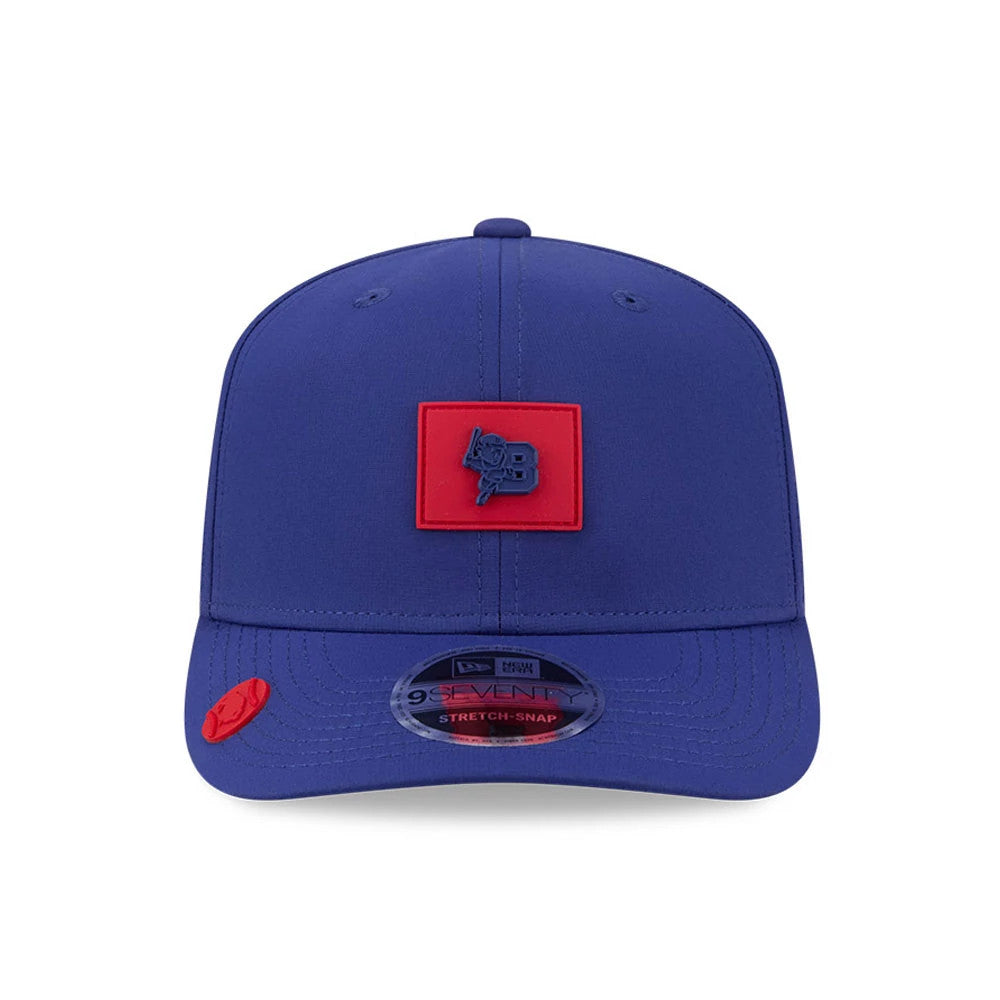 Buffalo Bisons MiLB Clubhouse Dark Blue New Era 9SEVENTY Stretch Snap Adjustable Cap, front view showing a navy team logo on a red patch, with a curved visor and 9SEVENTY size sticker, plus a red logo accent on the visor.