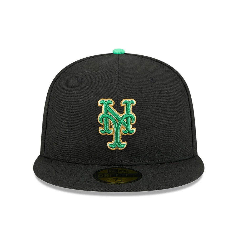 New York Mets MLB Saint Patrick's Day Black New Era 59FIFTY Fitted Cap, front view showing a green and gold NY logo in raised embroidery on the structured black crown, with a green top button and a gold 59FIFTY size sticker on the black visor.
