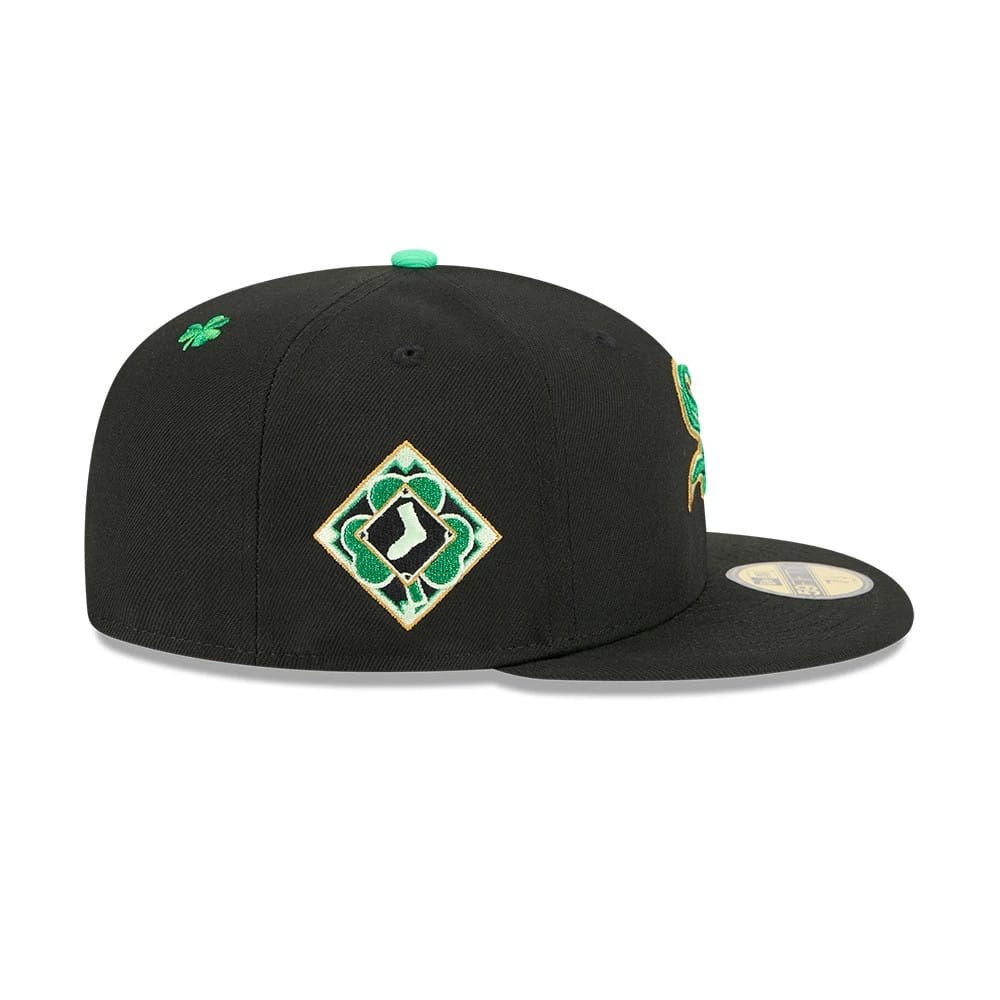 Chicago White Sox MLB Saint Patrick's Day Black New Era 59FIFTY Fitted Cap, side view showing a green shamrock embroidered on the right side with a diamond-shaped clover logo, and a gold 59FIFTY size sticker on the flat black visor.