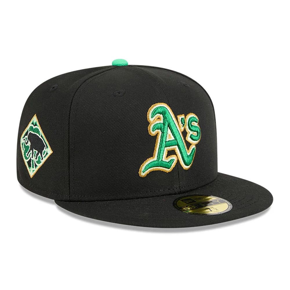 Athletics MLB Saint Patrick's Day Black New Era 59FIFTY Fitted Cap, three-quarter view showing a green and gold embroidered A's logo on the front panel with a black flat visor and gold 59FIFTY size sticker.