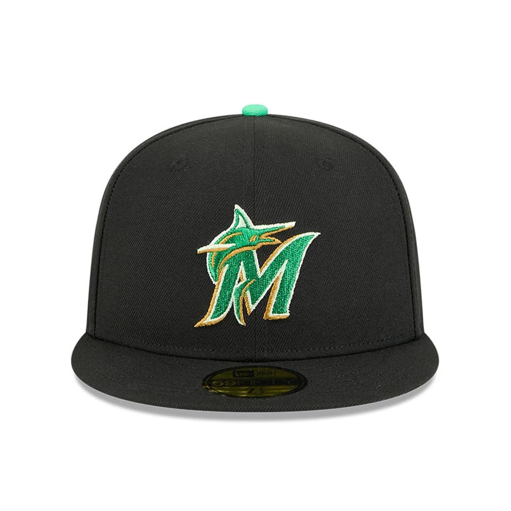 Miami Marlins MLB Saint Patrick's Day Black New Era 59FIFTY Fitted Cap, front view showing the green and gold embroidered Marlins logo on the black structured crown, with a black visor and gold 59FIFTY size sticker.