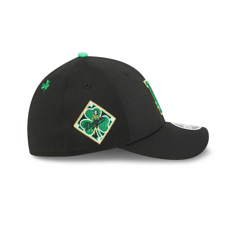 Dodgers MLB Saint Patrick's Day Black New Era 39THIRTY M-Crown A-Frame Stretch Fit Cap, side view showing a green and gold embroidered shamrock logo on the right side with a shamrock above, and a curved visor with a 39THIRTY size sticker.