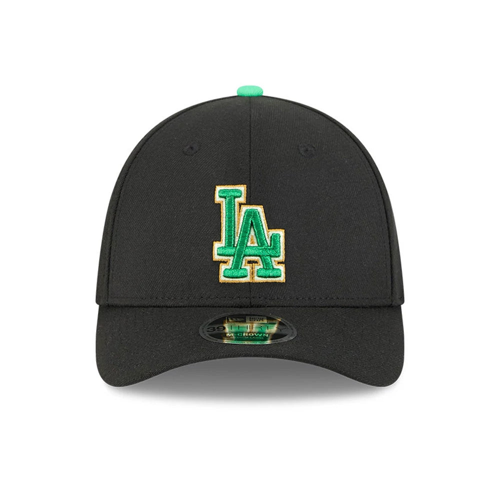 Dodgers MLB Saint Patrick's Day Black New Era 39THIRTY M-Crown A-Frame Stretch Fit Cap, front view showing a green and gold embroidered LA logo on the black structured crown with a 39THIRTY size sticker on the visor and a green top button.