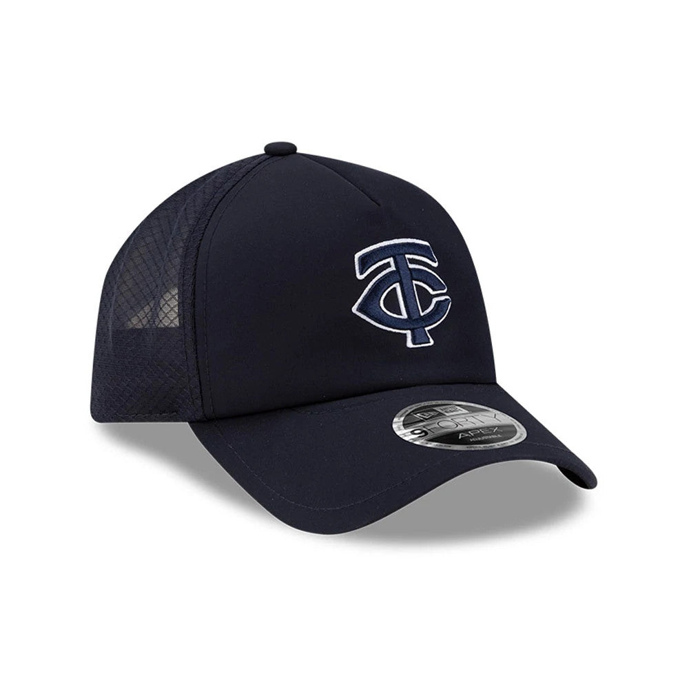 Minnesota Twins MLB Batting Practice 2026 Navy New Era 9FORTY Apex Adjustable Cap, three-quarter view showing the TC logo in white and navy raised embroidery on the front panel, with a curved visor and 9FORTY size sticker.